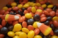 Heap of the autumn-colored round Reese Pieces and corn-like candies filled without packets Royalty Free Stock Photo