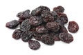 Heap of black flame raisins from Chili close up on white background