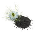 Heap of black nigella seeds and flower