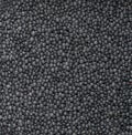 Heap of black organic beluga lentils frame filling texture