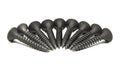 Heap of black steel screws arranged in a radial pattern Royalty Free Stock Photo