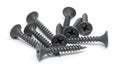 Heap of black steel screws on white background Royalty Free Stock Photo