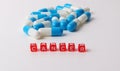 Blue and white capsules in the studio Royalty Free Stock Photo