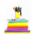 Heap of book and stationery against white background