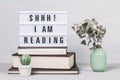 Heap of books and light box