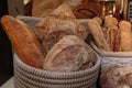 Heap of Bread Rolls Assortment and French Loaf inside Wicker Basket Royalty Free Stock Photo