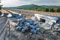 Heap of bricks and stones lying beside a newly built railway track