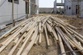 A heap of brown bamboo trunk on the ground for construction work in progress at a real estate property project site Royalty Free Stock Photo