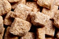 Heap brown cane unrefined sugar cubes