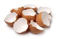 Heap of brown empty egg shells close up on white background