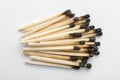 Heap of burnt matches on white background