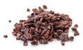 Heap of cacao nibs on white background