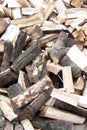 Heap of chopped firewood background. Pile of split firewood. Stack of fuel wood. Vertical view Royalty Free Stock Photo