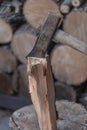 Heap of chopped wood, close up on the axe, cutting firewood and preparing winter wood Royalty Free Stock Photo