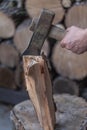 Heap of chopped wood, close up on the axe, cutting firewood and preparing winter wood Royalty Free Stock Photo