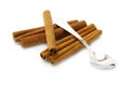 Heap of cinnamon sticks with teaspoon