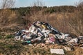 Heap of clothes garbage in the forest Royalty Free Stock Photo