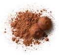 Heap of cocoa powder and chocolate truffles isolated on white background Royalty Free Stock Photo