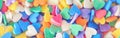 Heap of colorful candies confetti heart shape. Valentine Day holiday concept. Toned with retro vintage filters. Web banner header Royalty Free Stock Photo