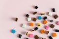 Heap of colorful Liquorice allsorts on pink background Royalty Free Stock Photo