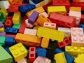 Heap of colorful, oversized plastic building blocks and construction bricks Royalty Free Stock Photo