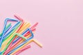 Heap of colorful plastic drinking straws on Colored background, flat lay. Copy Space for text Royalty Free Stock Photo