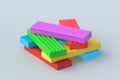 Heap of colorful plasticine bricks on gray background. Modeling clay