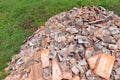 Heap of construction material building debris of old broken roof tiles pile mound stack Royalty Free Stock Photo