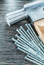 Heap of construction nails claw hammer top view Royalty Free Stock Photo