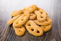 Heap of cookies in form of pretzels on table Royalty Free Stock Photo