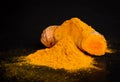 Curcuma turmeric spice powder on black background Royalty Free Stock Photo