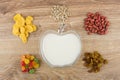 Heap of different ingredients for muesli and yogurt in bowl