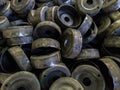 Heap of dirty black stamped metal round shells after a hood operation