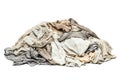 Heap of disheveled unsorted laundry piled isolated on a clean bright surface ready for washing Royalty Free Stock Photo