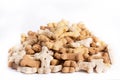 Heap of dog treats, goody bones isolated on white background.