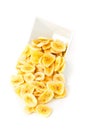 Heap of dried banana chips snack in white bowl over white Royalty Free Stock Photo
