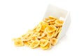 Heap of dried banana chips snack in white bowl over white Royalty Free Stock Photo