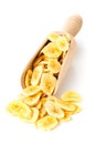 Heap of dried banana chips snack in wooden scoop over white Royalty Free Stock Photo