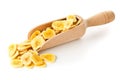 Heap of dried banana chips snack in wooden scoop over white Royalty Free Stock Photo