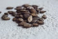 A heap of dried black watermelon seeds close-up on a white table background. planting season. close up top view copy space Royalty Free Stock Photo