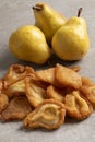Heap of dried pear fruit and fresh pears close up Royalty Free Stock Photo
