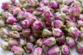 Heap of dried pink rosebuds for tea or aromatherapy. Rosebud textured flower background