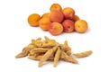 Heap of dried pitted sweet orange apricots and fresh apricots in the background Royalty Free Stock Photo