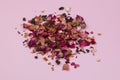 Heap of dried rose petals on pink background, top view Royalty Free Stock Photo