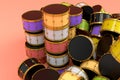 Heap of drums or drumset lying on pink background