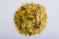 Heap of dry compound fish feed flakes