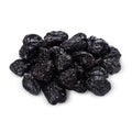 Heap of dry prunes isolated on white background with shadow, close up.