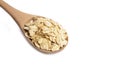 Heap of dry rolled oats isolated.