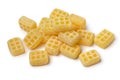 Heap of Dutch yellow butter waffle candy close up on white background