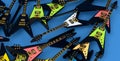 Heap of electric guitars isolated on blue background.